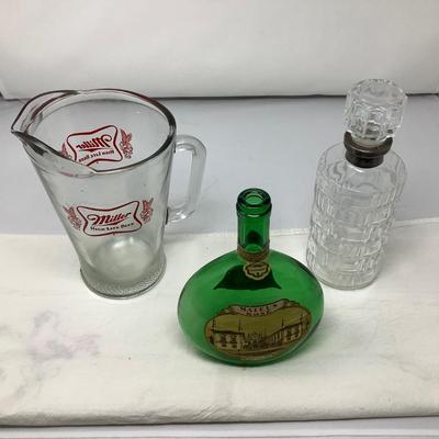 Sale Photo Thumbnail #149: Miller beer pitcher, glass decanter, and wine jug.