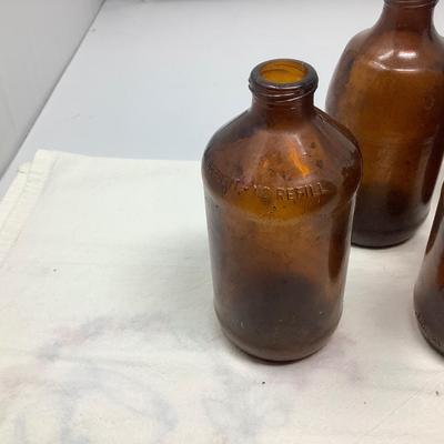 Sale Photo Thumbnail #157: 8 brown beer bottles