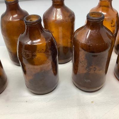 Sale Photo Thumbnail #154: 8 brown beer bottles