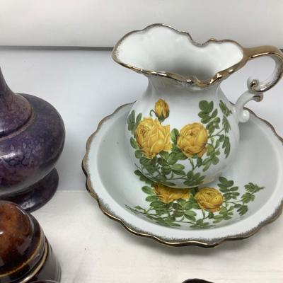 Sale Photo Thumbnail #58: Purple pitcher, yellow flower picture and bowl, 3 brown insulators, bear figurine.