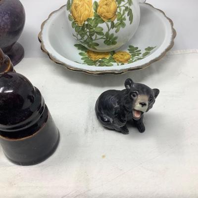 Sale Photo Thumbnail #60: Purple pitcher, yellow flower picture and bowl, 3 brown insulators, bear figurine.
