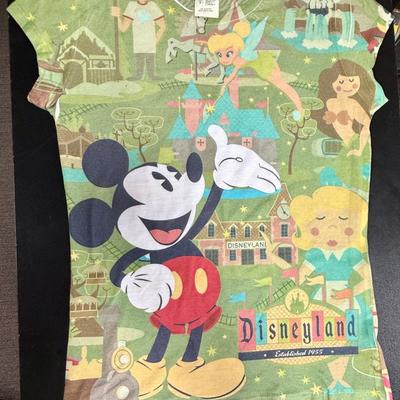 Sale Photo Thumbnail #371: Light-green with idealized 1955 images of the Disneyland Park. Good lightly-used condition.