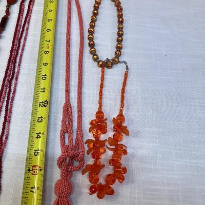 Sale Photo Thumbnail #287: Set of 7 pink/red/coral colored beaded necklaces, costume jewelry