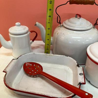 Sale Photo Thumbnail #311: 10 piece set of red/white enamel dishes including a baking dishes, slotted spoon, coffee pot, tea kettle, stock pot and other pot with lids