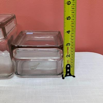 Sale Photo Thumbnail #329: Glass canister set with 5 sizes, all have sealing lids. No chips/cracks. Excellent condition.