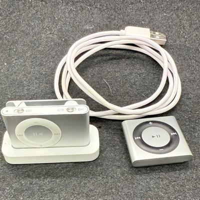 Sale Photo Thumbnail #440: Apple iPod Shuffle Pair: 2nd Gen A1204 Silver 1GB With Dock and Apple iPod A1373 Shuffle 4th Generation 2GB Music MP3 Player Silver.  2nd Gen tested, recharged as expected using the dock. Unable to test the smaller 4th Gen player.  Both look to be in usea
