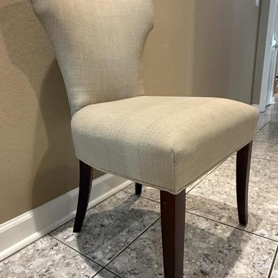 Sale Photo Thumbnail #192: A Classic glamour upholstered dining chair that cuts a striking silhouette. Classic modern hardwood legs are stained a dark finish.
Dimensions 21"Wx25"Dx37"H