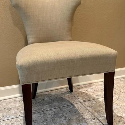 Sale Photo Thumbnail #193: A Classic glamour upholstered dining chair that cuts a striking silhouette. Classic modern hardwood legs are stained a dark finish.
Dimensions 21"Wx25"Dx37"H
