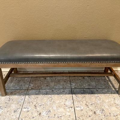 Sale Photo Thumbnail #203: Grey Faux Leather Bench with light brown wood legs