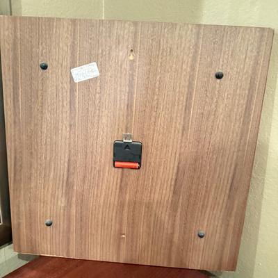 Sale Photo Thumbnail #217: Bent Wood Walnut Clock by Umbra. Dimensions 20" x 20".
Made of solid walnut, it has black metal hands, a second hand and runs on A batterie.