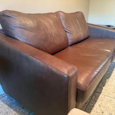 Sale Photo Thumbnail #230: Comfortable couch with a classic design. Chrome legs. 
Measures: 80"L x41"D x31"H (back part)/25"H (front arm )