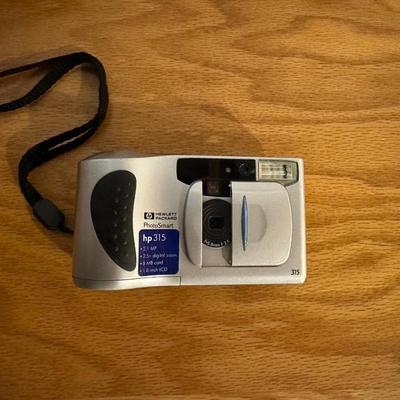 AM/FM ALARM CLOCK AND DIGITAL CAMERA
