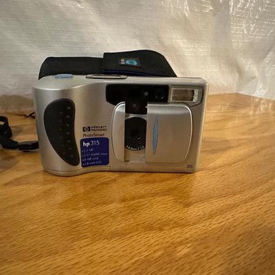 AM/FM ALARM CLOCK AND DIGITAL CAMERA