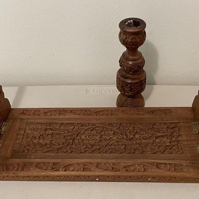 Sale Photo Thumbnail #3: This Hand carved bookend is collapsible and expandable and comes with a matching candle stick. Designed to hold and organize books, it can be expanded to accommodate more items or folded for compact when not in use. Made of wood, potentially teak, and fea