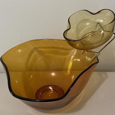 Sale Photo Thumbnail #7: Amber Triangular Chip & Dip Set with a smaller bowl suspended above it for dip and an avocado green serving bowl. The green bowl does have some chipping on the rim of the bowl. Please see photos for more details.