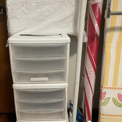 Sale Photo Thumbnail #103: Ironing board, cleaning supplies, toilet seat riser (in white bag), Kneeling pad, and more. Please see photos for more details.