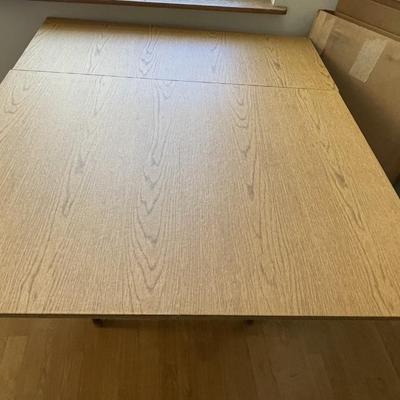 Sale Photo Thumbnail #184: The table measures approx. 39.25" in Diam. without leaf and leaf measures approx. 10" x 40", and table covers. Please see photos for more details.