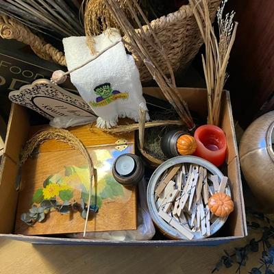 Sale Photo Thumbnail #302: . Box of clear glass vases, dry flowers, framed artwork, small table lamp, needlepoint tapestry, baskets and much more. Please see photos for more details.