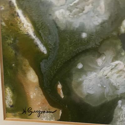 Sale Photo Thumbnail #330: This is an original H. Guyman alcohol ink painting, matted, and framed. The colors primarily consist of greens, yellows, and blues with some white and lighter tones, creating a fluid and organic appearance characteristics of alcohol ink art.  Please see p
