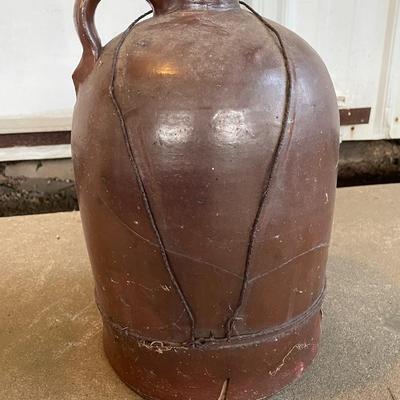 Sale Photo Thumbnail #381: The jug does have a lot of cracking from usage and age-13" Tall. Please see photos for more details.
