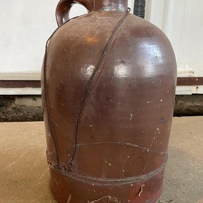 Sale Photo Thumbnail #379: The jug does have a lot of cracking from usage and age-13" Tall. Please see photos for more details.