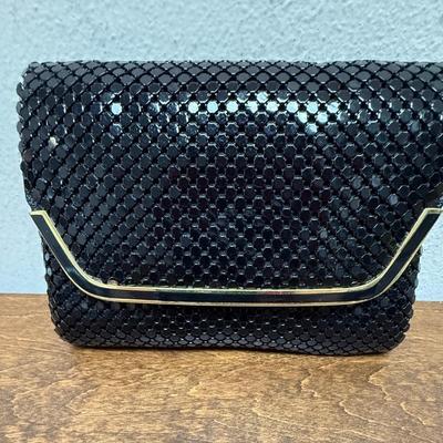 Sale Photo Thumbnail #288: Black sequins with gold tone snap closure. Chain shoulder strap tucks inside. Near new condition.