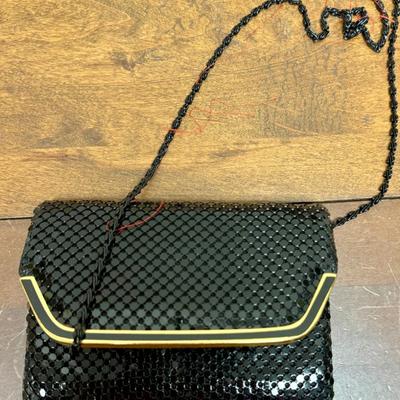 Sale Photo Thumbnail #289: Black sequins with gold tone snap closure. Chain shoulder strap tucks inside. Near new condition.