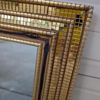 Mirror in gold mosaic frame