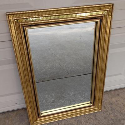 Mirror in gold mosaic frame