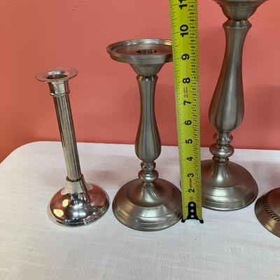 Sale Photo Thumbnail #408: Grouping of 5 pewter-like/silver metal candlesticks