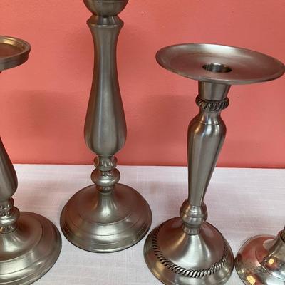 Sale Photo Thumbnail #406: Grouping of 5 pewter-like/silver metal candlesticks
