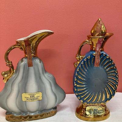 Sale Photo Thumbnail #433: Set of 2 vintage Jim Beam decanters dated 1970 & 1973 and 2 etched glass shot glasses