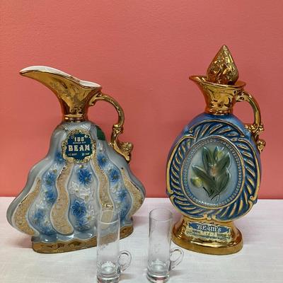 Sale Photo Thumbnail #430: Set of 2 vintage Jim Beam decanters dated 1970 & 1973 and 2 etched glass shot glasses