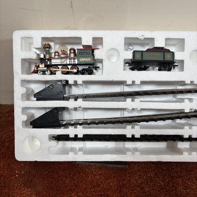 LOT 94: Vintage Wooden Childs Sled, Nutcracker Blow Mold (no light), Cast Iron Tree Stand and Lemax Village Train System