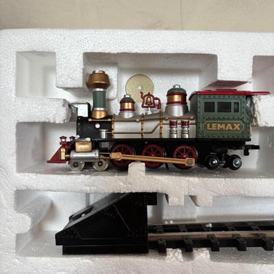 LOT 94: Vintage Wooden Childs Sled, Nutcracker Blow Mold (no light), Cast Iron Tree Stand and Lemax Village Train System