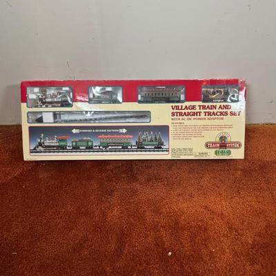 LOT 94: Vintage Wooden Childs Sled, Nutcracker Blow Mold (no light), Cast Iron Tree Stand and Lemax Village Train System