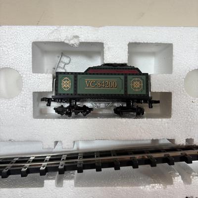 LOT 94: Vintage Wooden Childs Sled, Nutcracker Blow Mold (no light), Cast Iron Tree Stand and Lemax Village Train System