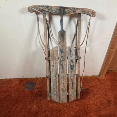 LOT 94: Vintage Wooden Childs Sled, Nutcracker Blow Mold (no light), Cast Iron Tree Stand and Lemax Village Train System