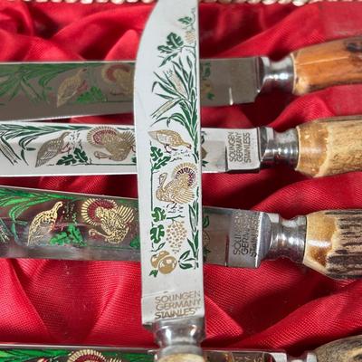 LOT 104: Solinger, Germany Steak Knives w/Hand-Carved Antler Handles featuring Etched and/or Enamel Scene on Blade, Silver Plate and...