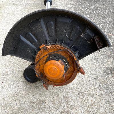 LOT 109: Worx Weed Trimmer / Edger with Wall Mount Battery Charger