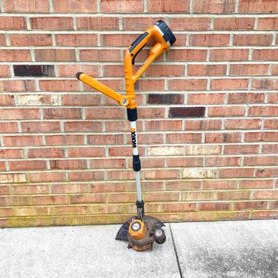 LOT 109: Worx Weed Trimmer / Edger with Wall Mount Battery Charger