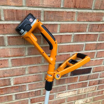 LOT 109: Worx Weed Trimmer / Edger with Wall Mount Battery Charger