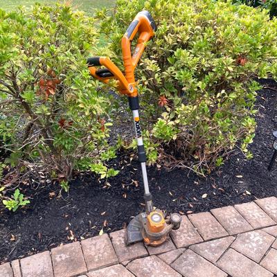 LOT 109: Worx Weed Trimmer / Edger with Wall Mount Battery Charger