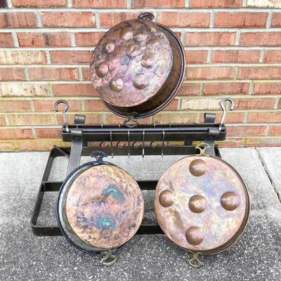 LOT 113: Heavy Duty Metal Hanging Kitchen Rack with Three Copper Bottom Pans