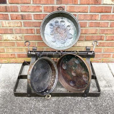 LOT 113: Heavy Duty Metal Hanging Kitchen Rack with Three Copper Bottom Pans