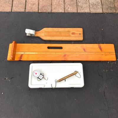 LOT 119: Fishing Nets, Fishing Pole Holders, Fish Filleting Boards, and Scales