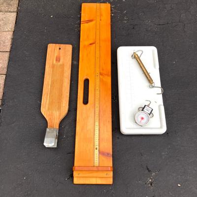 LOT 119: Fishing Nets, Fishing Pole Holders, Fish Filleting Boards, and Scales