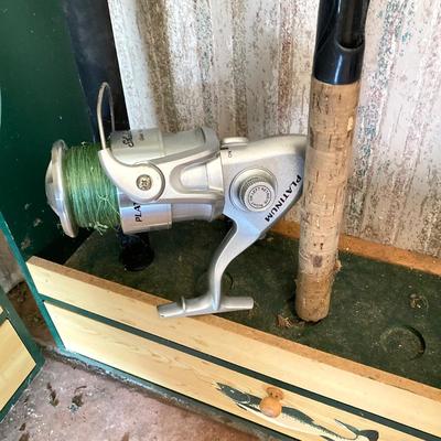 LOT 120: Wooden Fishing Rod Holder with Rods and Reels