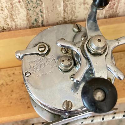LOT 120: Wooden Fishing Rod Holder with Rods and Reels