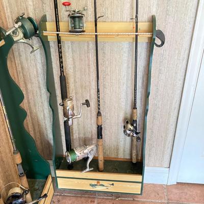 LOT 120: Wooden Fishing Rod Holder with Rods and Reels